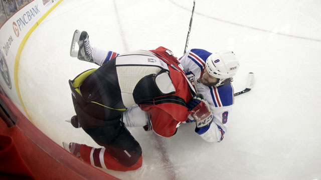 Brandon Prust of the New York Rangers elbows Devils’ defender Anton Volchenkov in the back of the head in Game 3 of the Eastern Conference final. Prust gets one game for the elbow. (AP/Julio Cortez)