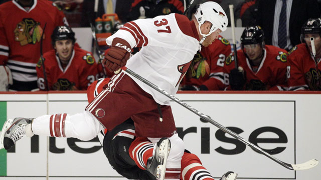 Raffi Torres of the Phoenix Coyotes catches Marian Hossa with his head down and knocks the Chicago Blackhawks forward out. Torres gets 25 games for his Round 1, Game 3 indiscretion. (AP/Nam Y. Huh)