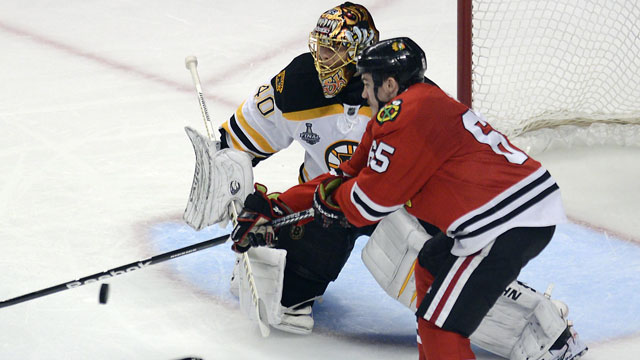 Andrew Shaw gave the Chicago Blackhawks a toehold in their Stanley Cup final against the Boston Bruins, taking Game 1 in 2013 at 12:08 of the 3rd overtime. (AP/John Starks)