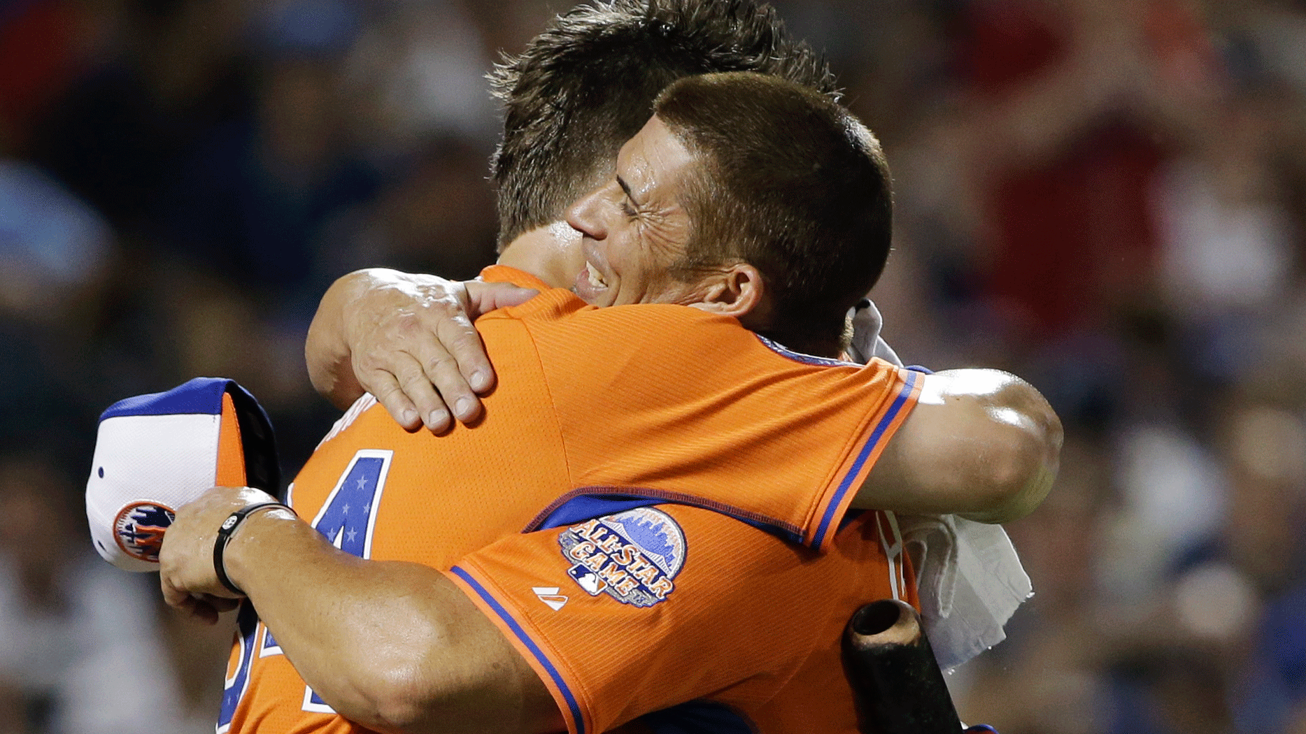 Bryce Harper hugs his father and pitcher Ron. (AP/Matt Slocum)