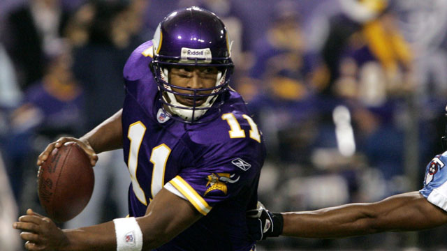 Daunte Culpepper of the Minnesota Vikings throws the most passing yards in the NFL, aided mostly by the dominant Randy Moss. (AP/Ann Heisenfelt)