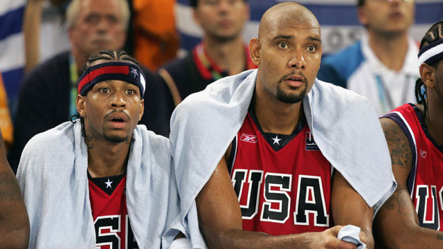 Allen Iversen and Tim Duncan (right) look on in disbelief as Team USA basketball loses to Lithuania and Greece at the 2004 Summer Games in Athens. (AP/Dusan Vranic)
