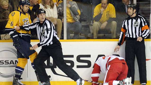 Shea Weber smashes Henrik Zetterberg’s head into the boards in the closing seconds of Game 1 of their first round series. No discipline is handed out to Weber. (AP/Sanford Myers)