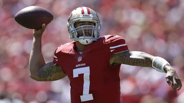 Colin Kaepernick threw for three touchdowns and 412 yards and added 22 yards on the ground for the San Francisco 49ers (AP/Ben Margot)