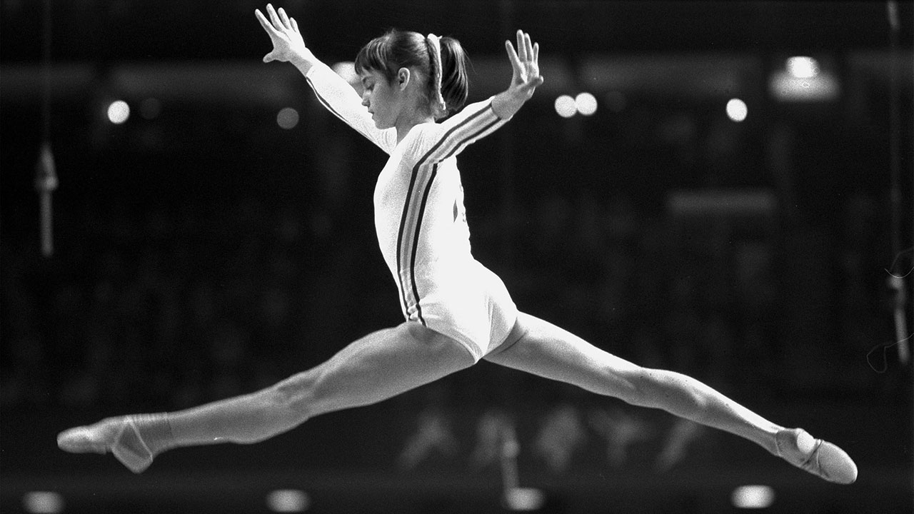 Nadia Comaneci performs a balanced jump on the horse vault at the Montreal ...