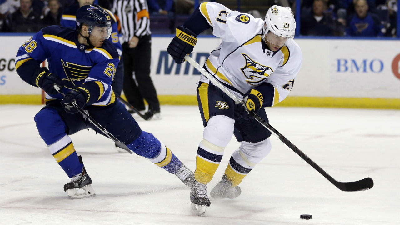 Nashville-Predators'-Derek-Roy-controls-the-puck-as-St.-Louis-Blues'-Ian-Cole-watches-during-the-first-period-of-an-NHL-hockey-game-Saturday,-Nov.-8,-2014,-in-St.-Louis.-(Jeff-Roberson/AP)