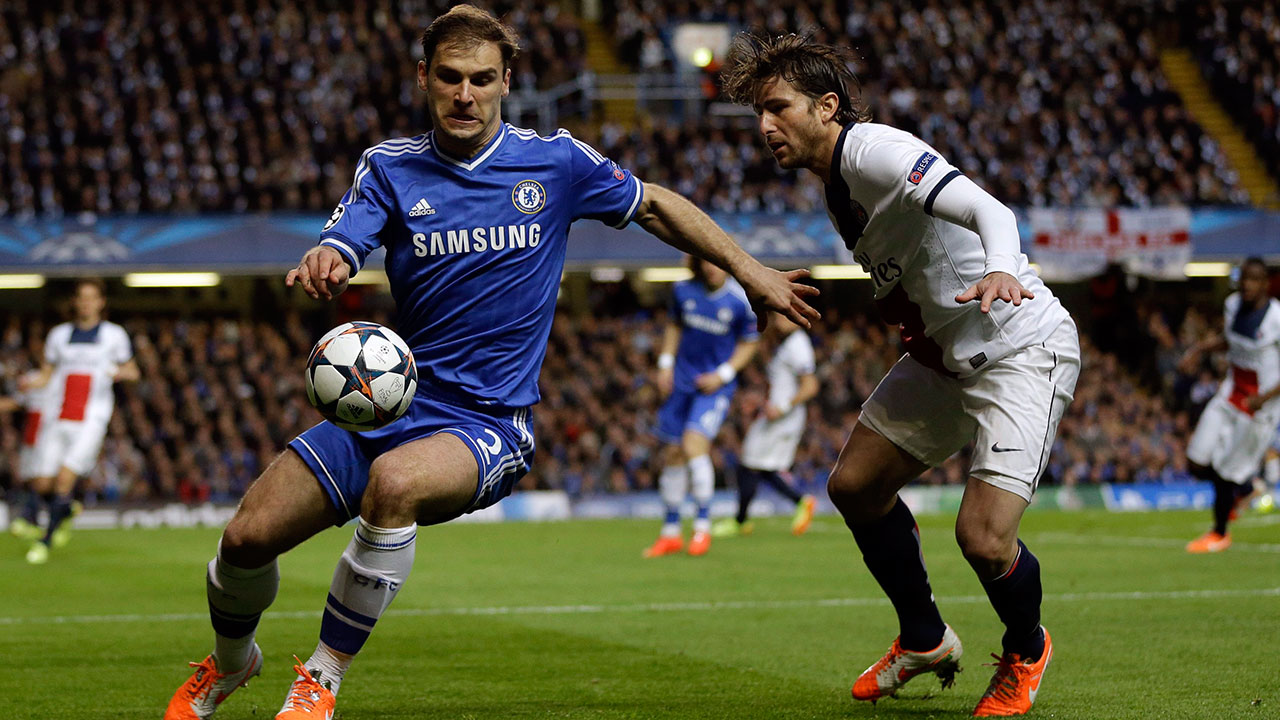 Chelsea's Branislav Ivanovic, left, and PSG's Maxwell go for the ball during the Champions League second leg quarterfinal soccer match between Chelsea and Paris Saint-Germain at Stamford Bridge Stadium in London, Tuesday, April 8, 2014. (AP Photo/Kirsty Wigglesworth)