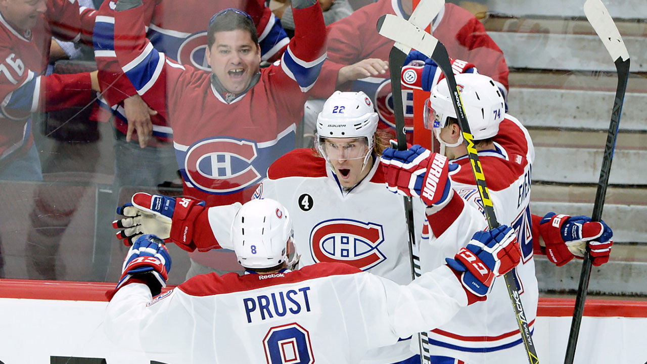 Montreal-Canadiens-forward-Dale-Weise-(22)-celebrates-his-goal-against-the-Ottawa-Senators-with-teammates-Brandon-Prust-(8)-and-Alexei-Emelin-(74)-during-the-third-period-of-game-3-of-first-round-Stanley-Cup-NHL-playoff-hockey-action-in-Ottawa-on-Sunday,-April-19,-2015.-(Sean-Kilpatrick/CP)