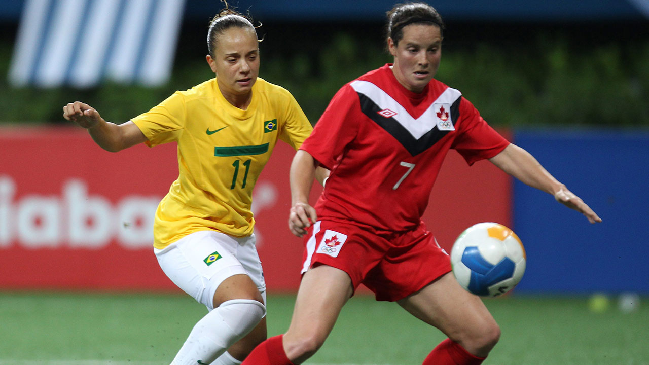 Canada's Rhian Wilkinson, right, fights for the ball with Brazil's Thais Guedes during a women's soccer match at the Pan American Games in Guadalajara, Mexico, Saturday, Oct. 22, 2011. (AP Photo/Juan Karita)