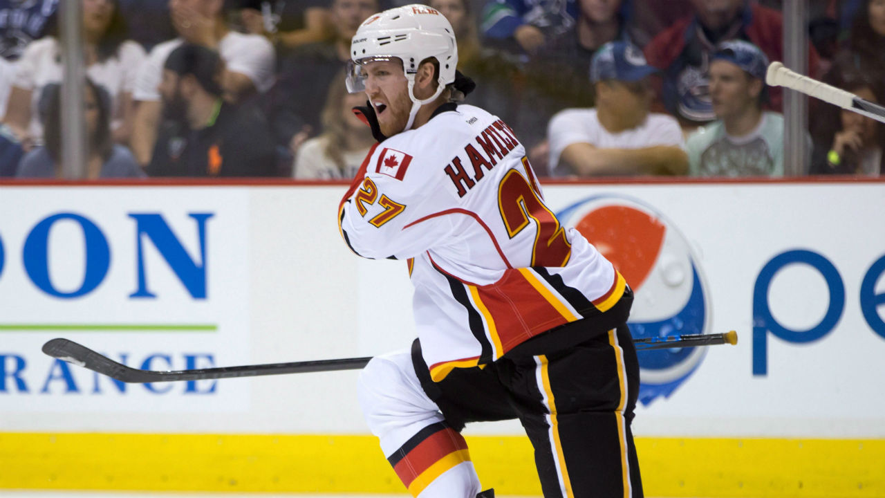 Calgary-Flames'-Dougie-Hamilton-celebrates-his-goal-against-the-Vancouver-Canucks-during-the-first-period-of-an-NHL-hockey-game-in-Vancouver,-B.C.,-on-Saturday,-October-10,-2015.-(Darryl-Dyck/CP)