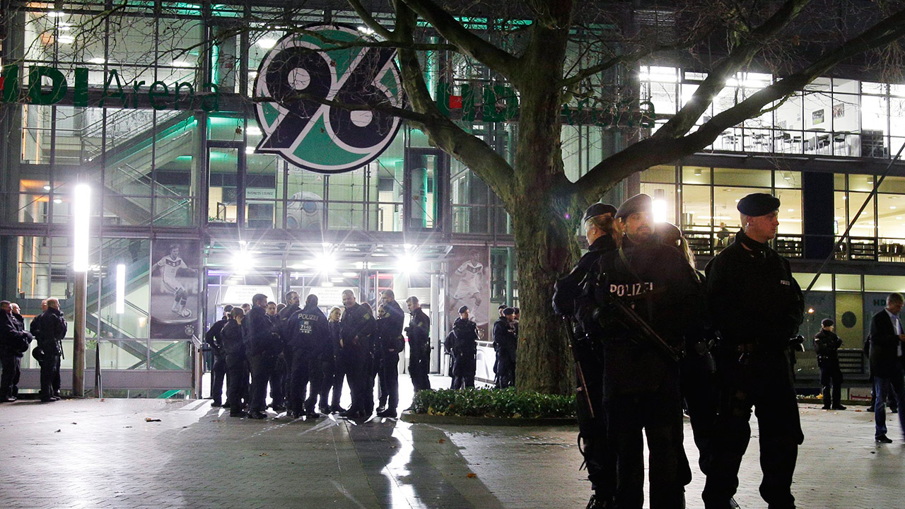 Police officers stand outside the HDI-Arena stadium as the soccer friendly match between Germany and the Netherlands was cancelled in Hannover, Germany, Tuesday, Nov. 17, 2015. (Michael Sohn/AP)