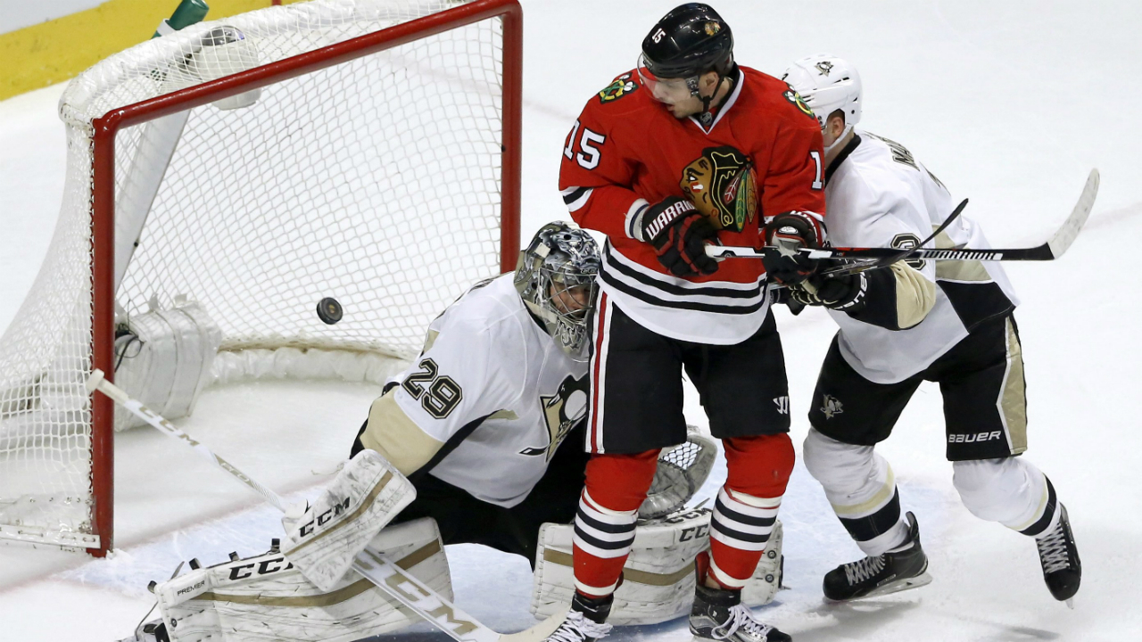 Chicago-Blackhawks-center-Artem-Anisimov-(15)-watches-the-shot-by-teammate-Artemi-Panarin-go-in-for-a-goal-past-Pittsburgh-Penguins-goalie-Marc-Andre-Fleury,-as-Olli-Maatta-also-defends-during-the-first-period-of-an-NHL-hockey-game-Wednesday,-Jan.-6,-2016,-in-Chicago.