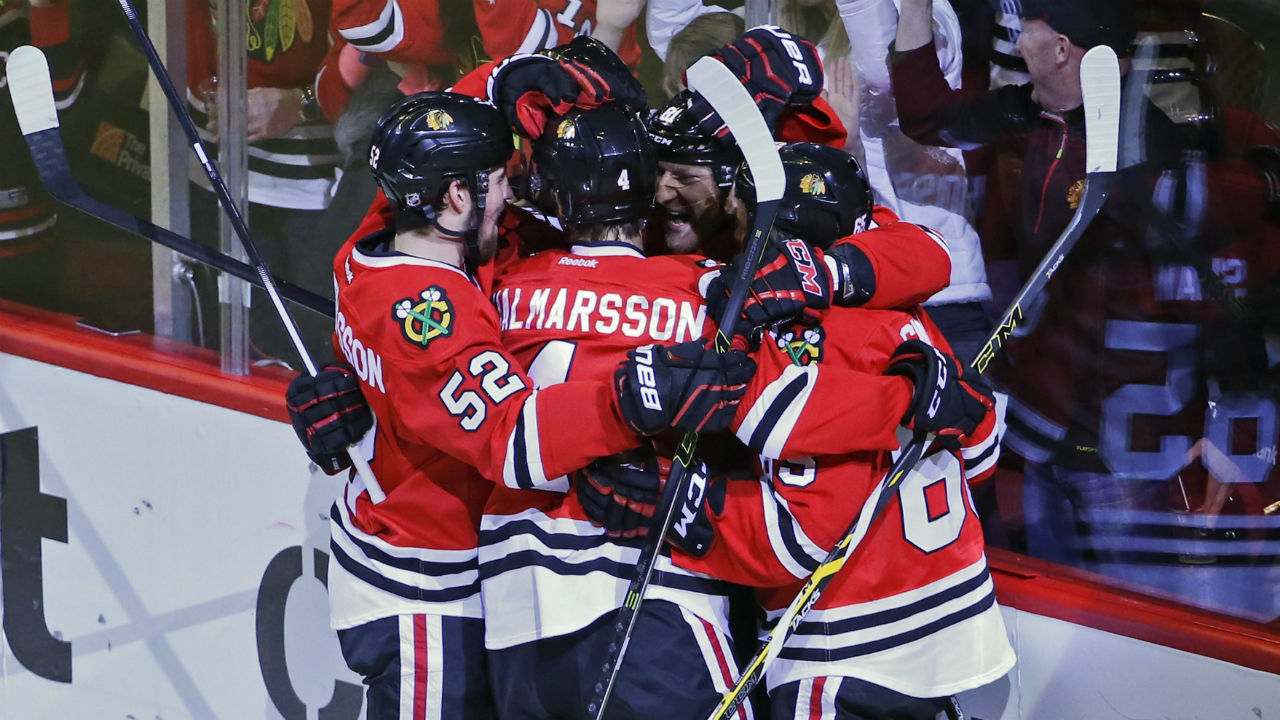 Chicago-Blackhawks-right-wing-Marian-Hossa,-back,-celebrates-with-teammates-after-scoring-against-the-Colorado-Avalanche-during-the-second-period-of-an-NHL-hockey-game-Sunday,-Jan.-10,-2016,-in-Chicago.