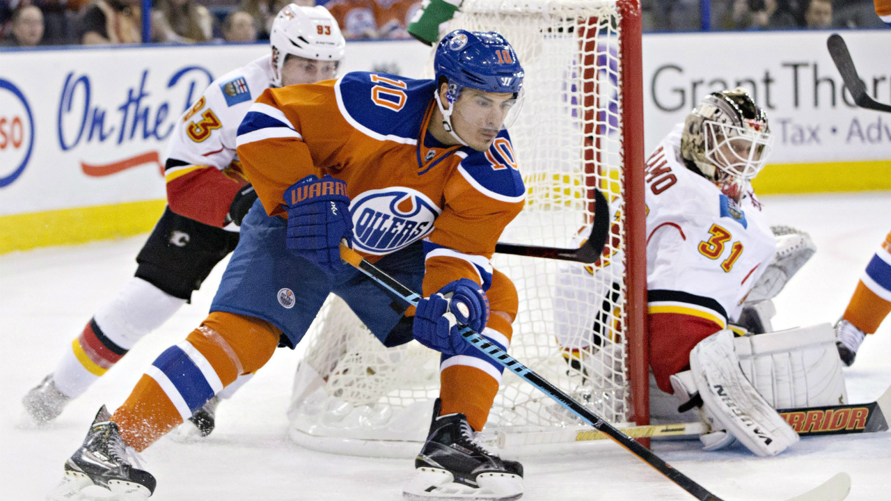Calgary-Flames'-Sam-Bennett-(93),-left,-chases-Edmonton-Oilers'-Nail-Yakupov-(10)-as-goalie-Karri-Ramo-(31),-right,-looks-for-the-puck-during-second-period-NHL-action-in-Edmonton,-Alta.,-on-Saturday,-Oct.-31,-2015.