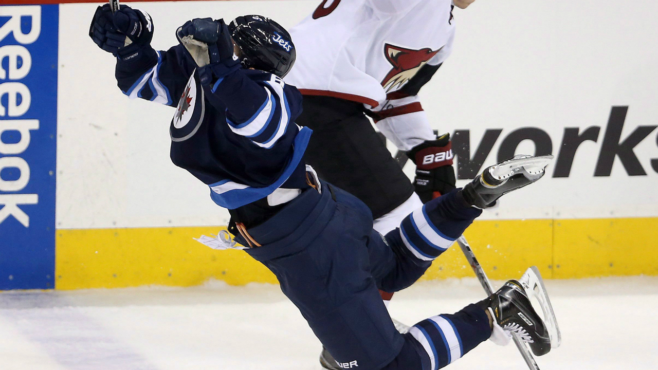 Winnipeg-Jets'-Alexander-Burmistrov-(6)-is-tripped-by-Arizona-Coyotes'-Michael-Stone-(26)-during-third-period-NHL-hockey-action,-in-Winnipeg-on-Tuesday,-Jan.-26,-2016.-THE-CANADIAN-PRESS/Trevor-Hagan