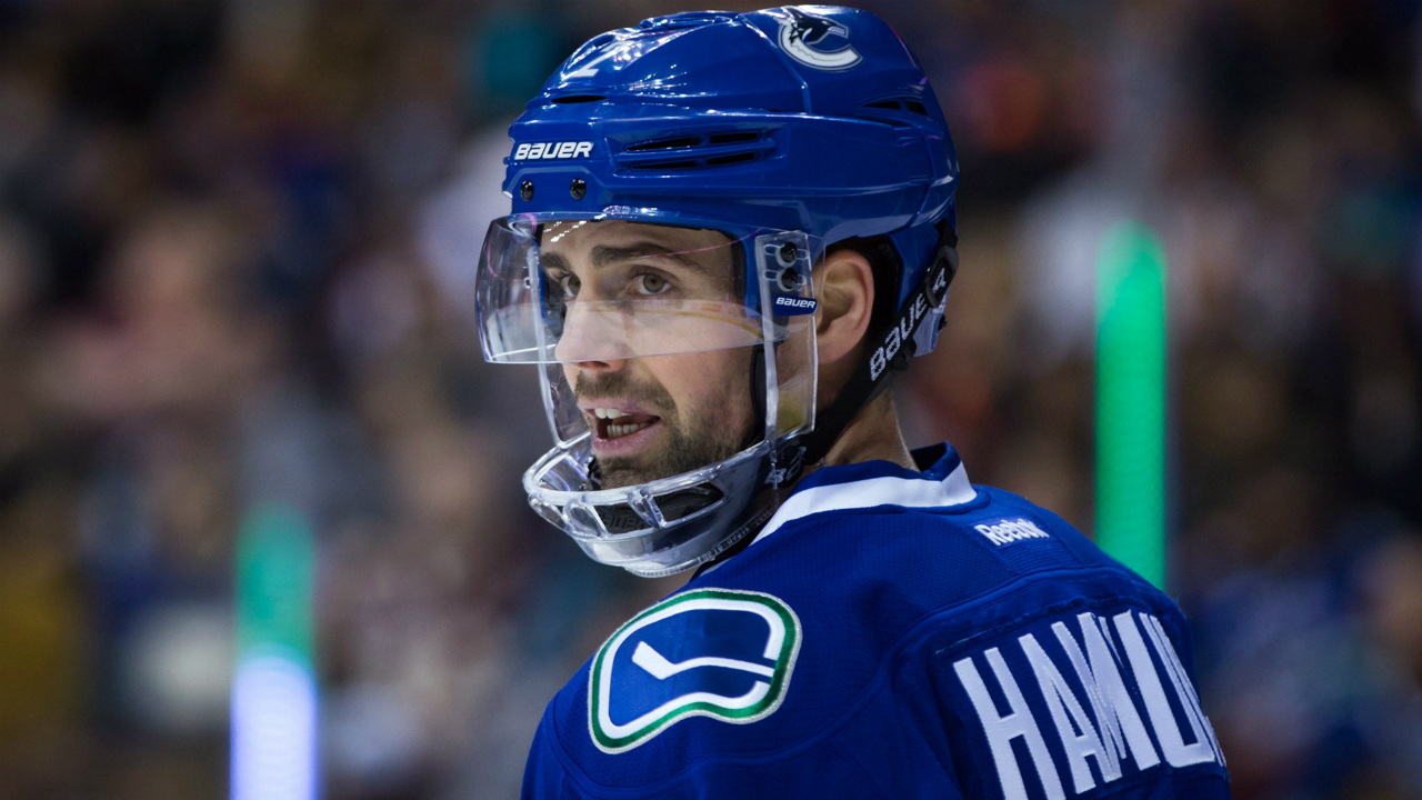 Vancouver-Canucks'-Dan-Hamhuis-looks-on-during-a-stoppage-during-first-period-NHL-hockey-action-against-the-San-Jose-Sharks,-in-Vancouver-on-Sunday,-Feb.-28,-2016.-THE-CANADIAN-PRESS/Darryl-Dyck
