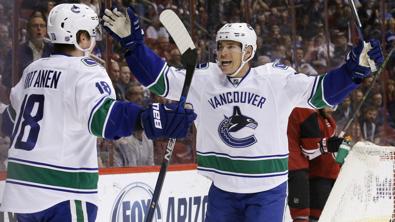 Vancouver-Canucks'-Jake-Virtanen-(18)-celebrates-his-goal-against-the-Arizona-Coyotes-with-Adam-Cracknell-(24)-during-the-first-period-of-an-NHL-hockey-game-Wednesday,-Feb.-10,-2016,-in-Glendale,-Ariz.-(AP-Photo/Ross-D.-Franklin)