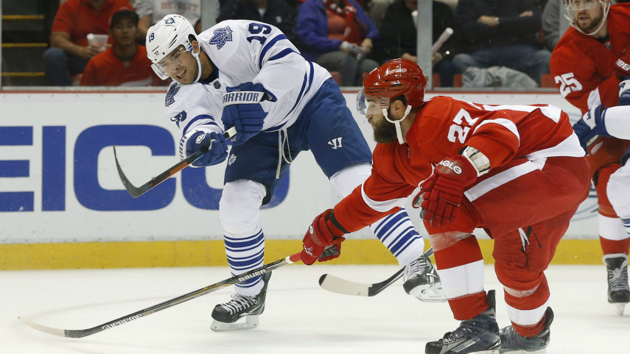 Toronto-Maple-Leafs-right-wing-Joffrey-Lupul-(19)-shoots-as-Detroit-Red-Wings-defenseman-Kyle-Quincey-(27)-defends-in-the-first-period-of-an-NHL-hockey-game-in-Detroit-Friday,-Oct.-9,-2015.-(AP-Photo/Paul-Sancya)