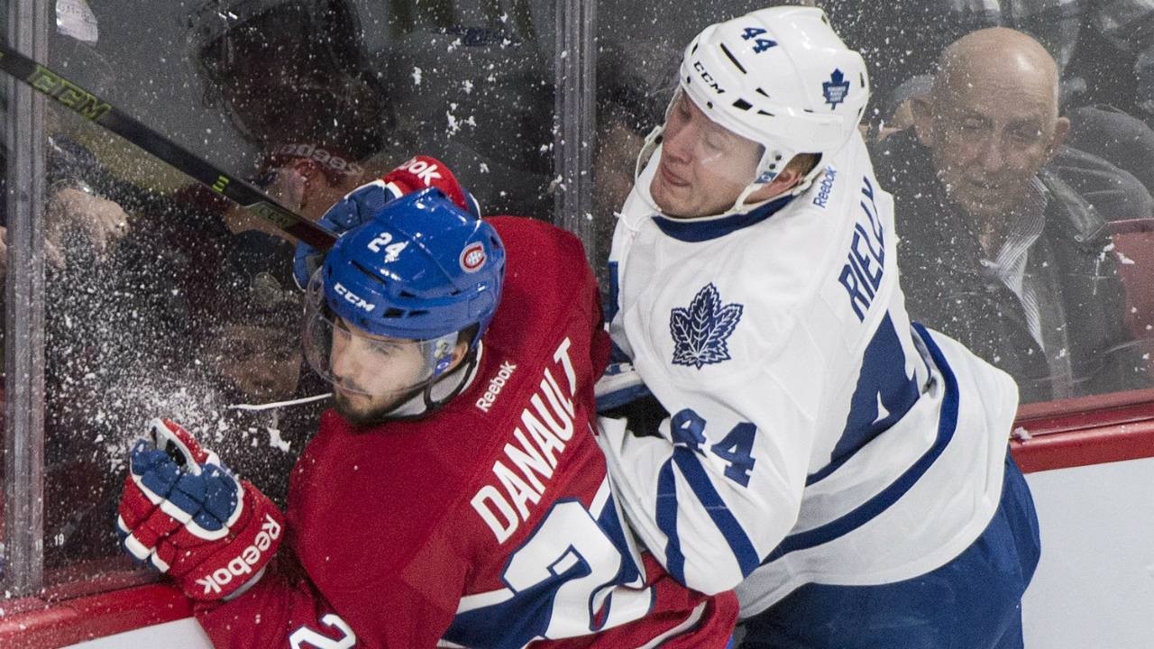 Montreal-Canadiens'-Phillip-Danault-(24)-collies-with-Toronto-Maple-Leafs'-Morgan-Rielly-(44)-during-first-period-NHL-hockey-action-in-Montreal,-Saturday,-February-27,-2016.-THE-CANADIAN-PRESS/Graham-Hughes