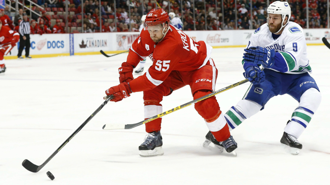 Detroit-Red-Wings-defenseman-Niklas-Kronwall-(55)-keeps-the-puck-from-Vancouver-Canucks-right-wing-Brandon-Prust-(9)-in-the-second-period-of-an-NHL-hockey-game-Friday,-Dec.-18,-2015-in-Detroit.-(AP-Photo/Paul-Sancya)
