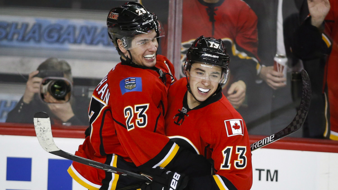 Calgary-Flames'-Sean-Monahan,-left,-celebrates-his-goal-with-teammate-Johnny-Gaudreau-during-third-period-NHL-hockey-action-against-the-Carolina-Hurricanes-in-Calgary,-Wednesday,-Feb.-3,-2016.THE-CANADIAN-PRESS/Jeff-McIntosh