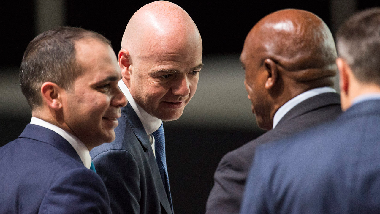 Tokyo Sexwale, candidate for FIFA president, of South Africa, right, speaks to candidates Prince Ali bin Al Hussein, of Jordan, left, and Gianni Infantino, of Switzerland in 2016. (Ennio Leanza/AP)