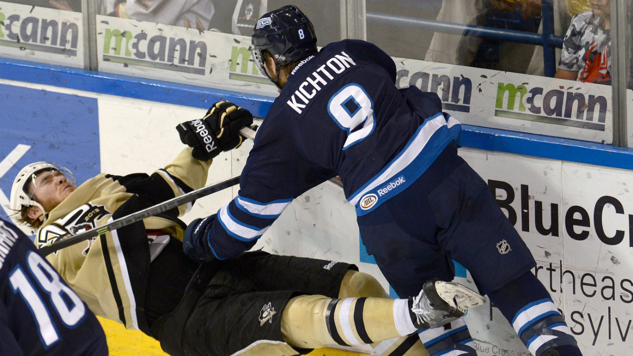 St.-John's-IceCap's-Brenden-Kichton,-right,-takes-down-Wilkes-Barre/Scranton-Penguins'-Carter-Rowney,-Thursday,-May-29,-2014,-during-an-AHL-hockey-Eastern-Conference-finals-playoff-game,-Thursday,-May-29,-2014,-in-Wilkes-Barre,-Pa.-(AP-Photo/The-Citizens'-Voice,-Andrew-Krech)