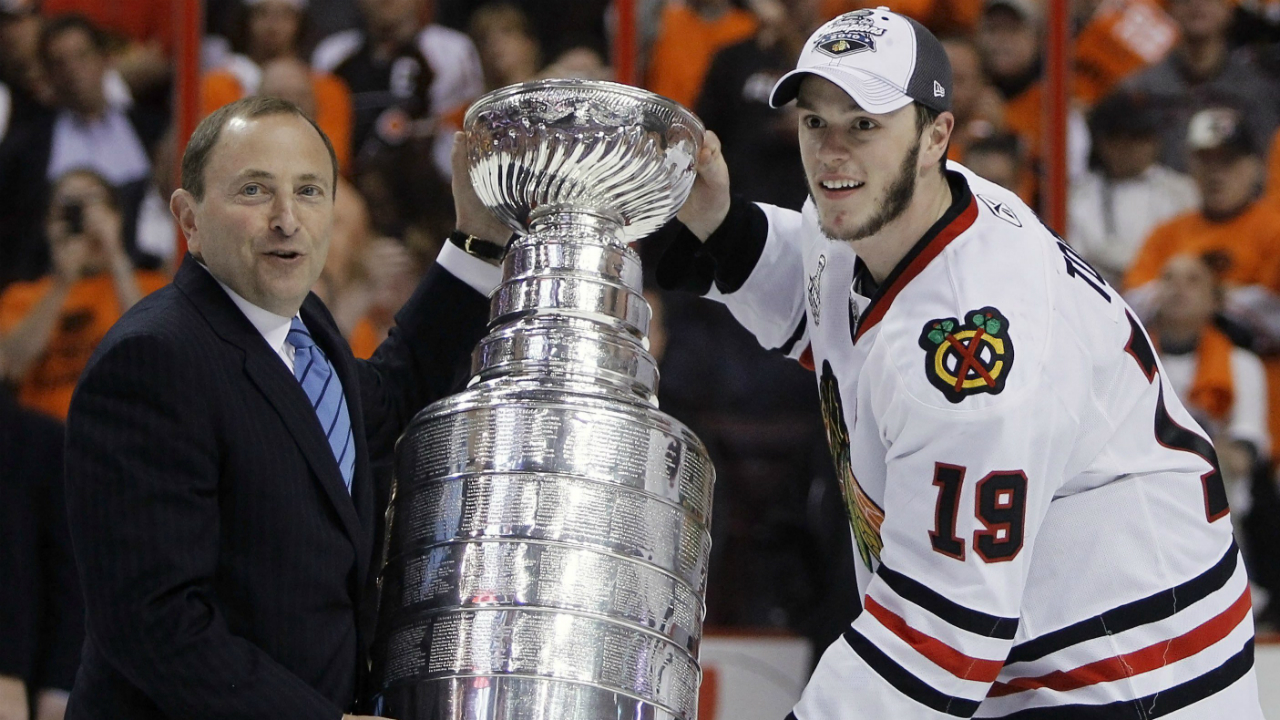 Chicago-Blackhawks-center-Jonathan-Toews-is-presented-the-Stanley-Cup-by-NHL-commissioner-Gary-Bettman-after-the-Blackhawks-beat-the-Philadelphia-Flyers-4-3-in-overtime-to-win-Game-6-of-the-NHL-Stanley-Cup-hockey-finals-Wednesday,-June-9,-2010,-in-Philadelphia.-(AP-Photo/Matt-Slocum)