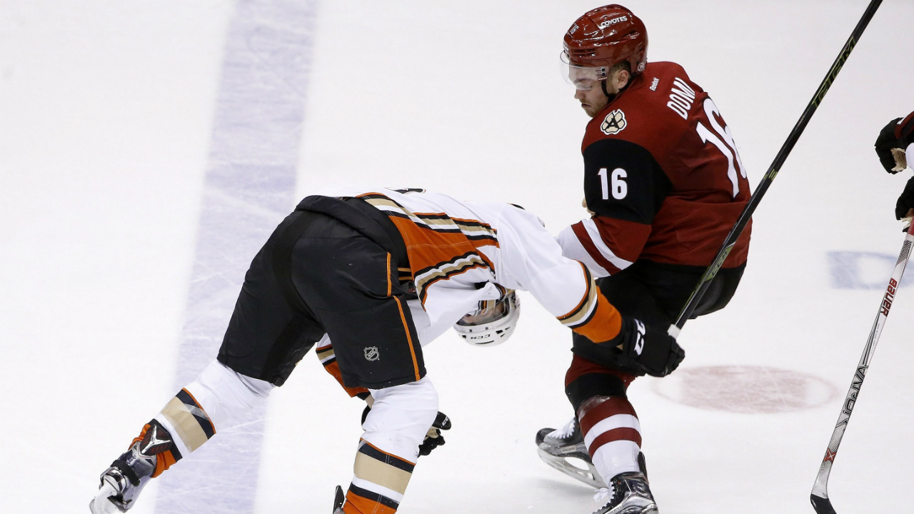 Arizona-Coyotes'-Max-Domi-(16)-pulls-down-Anaheim-Ducks'-Ryan-Garbutt,-left,-as-the-two-fight-during-the-third-period-of-an-NHL-hockey-game-Thursday,-March-3,-2016,-in-Glendale,-Ariz.-The-Ducks-defeated-the-Coyotes-5-1.-(AP-Photo/Ross-D.-Franklin)