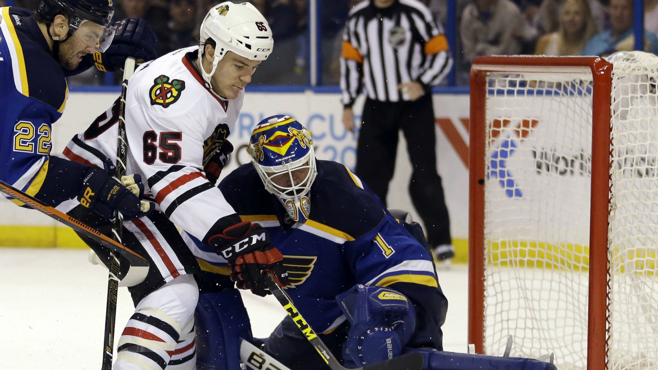 Chicago-Blackhawks'-Andrew-Shaw,-left,-scores-past-St.-Louis-Blues-goalie-Brian-Elliott-during-the-third-period-in-Game-2-of-an-NHL-hockey-first-round-Stanley-Cup-playoff-series-Friday,-April-15,-2016,-in-St.-Louis.-(AP-Photo/Jeff-Roberson)