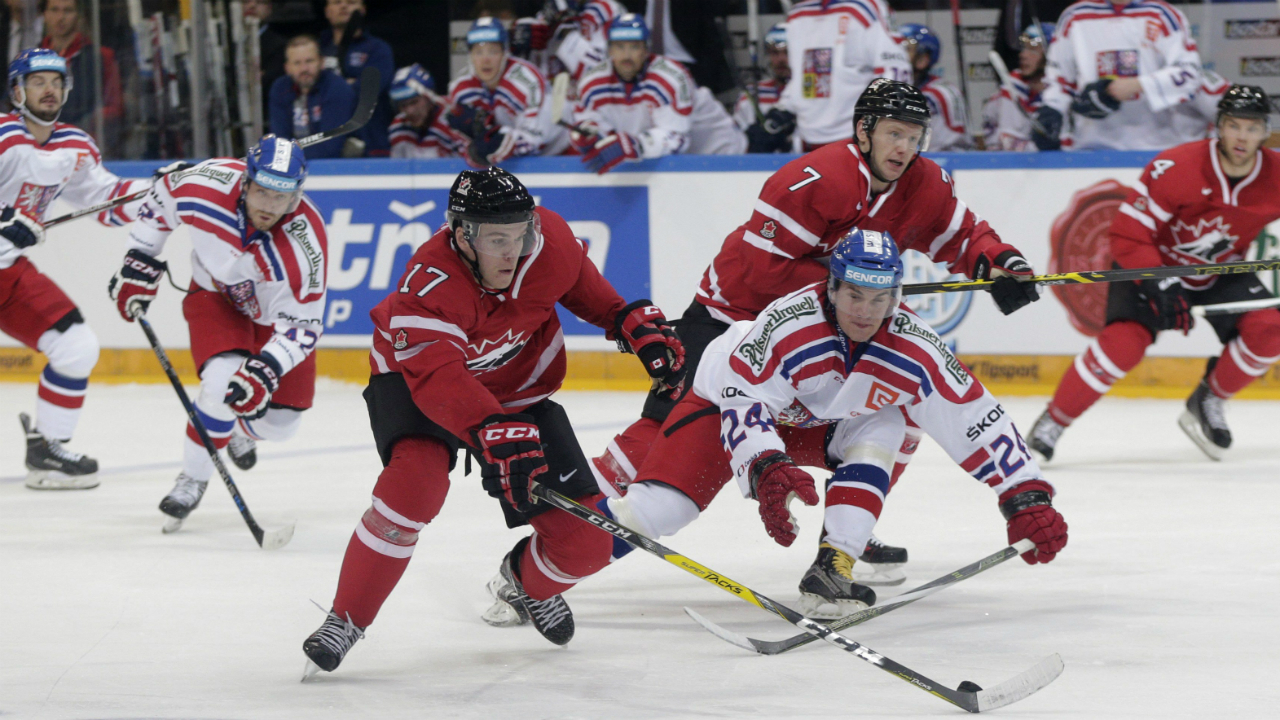 Czech-Republic's-Petr-Zamorsky,-center-right,-challenges-Canada's-Connor-McDavid,-center-left,-during-their-ice-hockey-friendly-match-in-Prague,-Czech-Republic,-Tuesday,-May-3,-2016.-(AP-Photo/Petr-David-Josek)