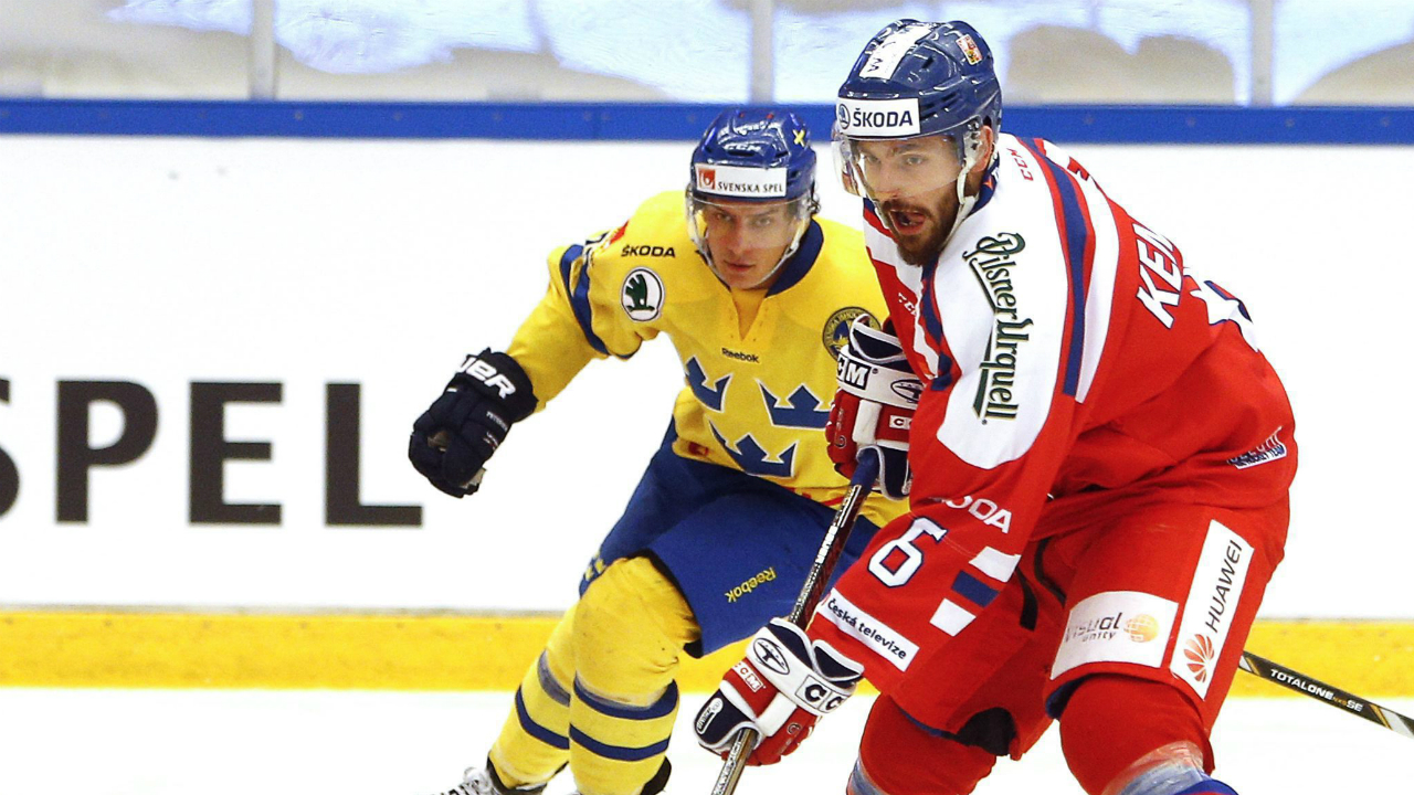 Czech-Michal-Kempny,-right,-against-Sweden-during-the-Euro-Hockey-Tour-ice-hockey-match-between-Sweden-and-Czech-Republic-at-E.ON-Arena-in-Timra,-Sweden,-Sunday-April-19,-2015.-(Therese-Ny,-TT-via-AP)-SWEDEN-OUT