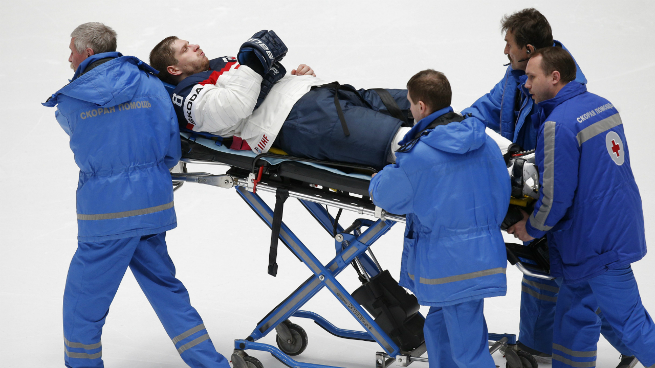 Paramedics-evacuate-Slovakia’s-Michal-Sersen-as-he-was-injured-during-the-Hockey-World-Championships-Group-B-match-against-Belarus-in-St.Petersburg,-Russia,-Wednesday,-May-11,-2016.-(AP-Photo/Dmitri-Lovetsky)