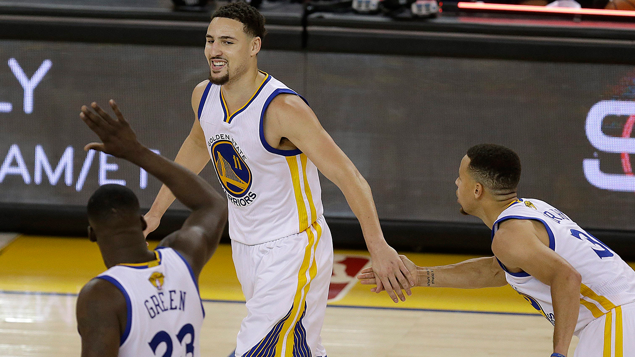 Golden-State-Warriors-guard-Klay-Thompson,-center,-celebrates-with-forward-Draymond-Green-(23)-and-guard-Stephen-Curry-during-the-second-half-of-Game-1-of-basketball's-NBA-Finals-against-the-Cleveland-Cavaliers-in-Oakland,-Calif.,-Thursday,-June-2,-2016.-The-Warriors-won-104-89.-(Ben-Margot/AP)