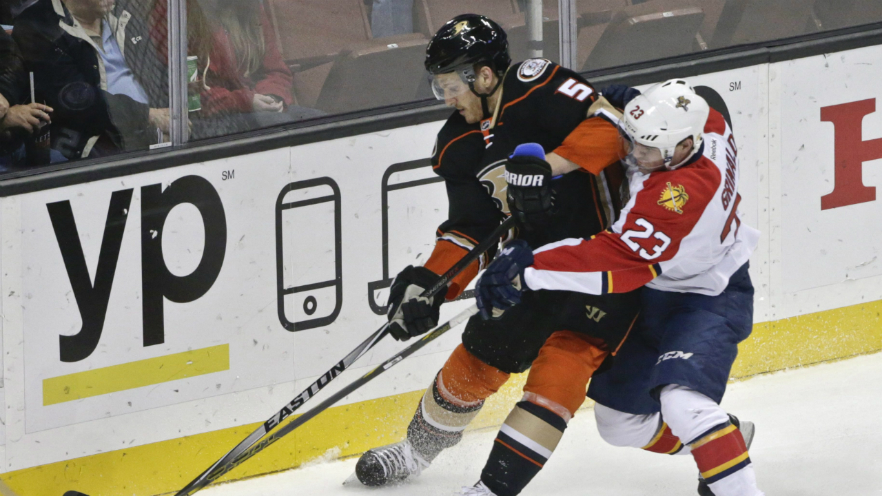 Anaheim-Ducks-defenseman-Korbinian-Holzer-is-pressed-by-Florida-Panthers-center-Rocco-Grimaldi-during-the-first-period-of-an-NHL-hockey-game-Wednesday,-Nov.-4,-2015,-in-Anaheim,-Calif.-(AP-Photo/Lenny-Ignelzi)