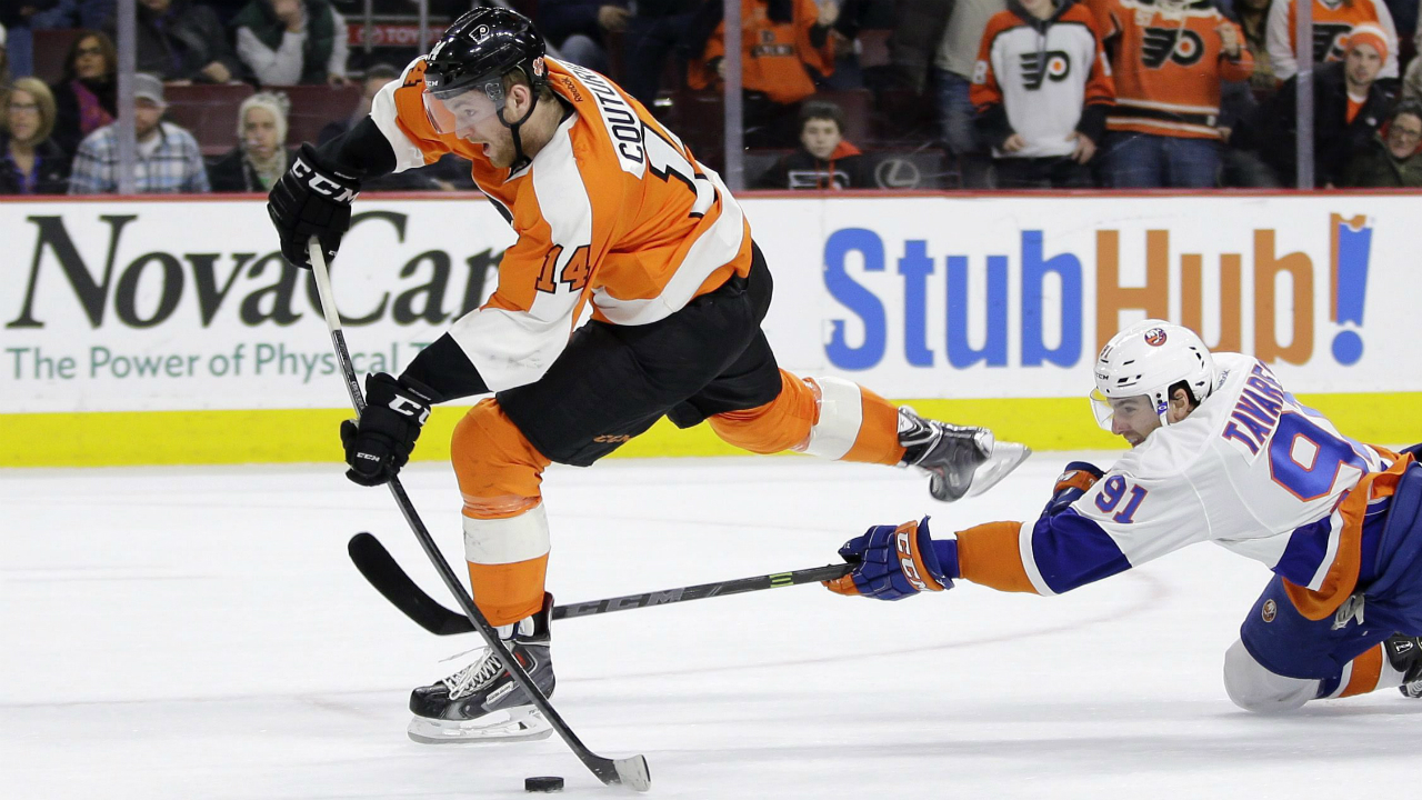 Philadelphia-Flyers'-Sean-Couturier,-left,-tries-to-get-a-shot-off-as-New-York-Islanders'-John-Tavares-defends-during-overtime-of-an-NHL-hockey-game,-Thursday,-Feb.-5,-2015,-in-Philadelphia.-New-York-won-3-2-in-a-shootout.-(AP-Photo/Matt-Slocum)