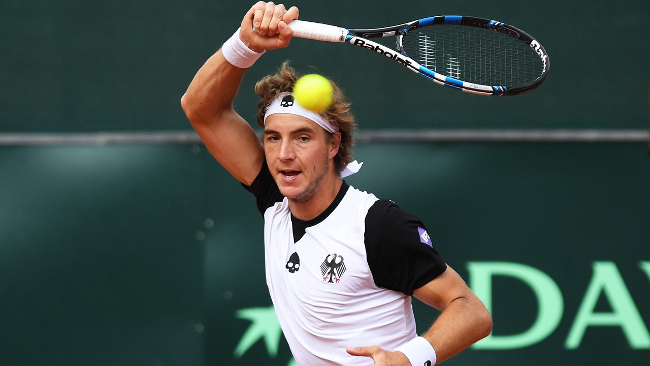 Germany's Jan-Lennard Struff returns a ball to Poland's Hubert Hurkacz. (Soeren Stache/dpa via AP)