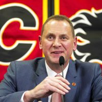 Calgary-Flames'-new-GM-Brad-Treliving-speaks-at-a-press-conference-after-being-introduced-in-Calgary,-Alta.,-on