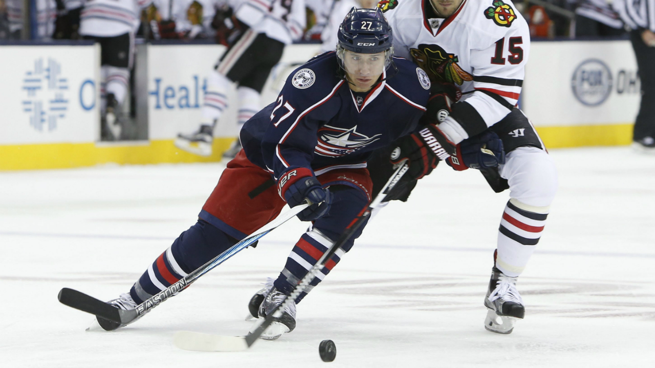 Columbus-Blue-Jackets'-Ryan-Murray,-left,-tries-to-move-the-puck-past-Chicago-Blackhawks'-Artem-Anisimov,-of-Russia,-during-the-first-period-of-an-NHL-hockey-game-Friday,-Oct.-21,-2016,-in-Columbus,-Ohio.-(AP-Photo/Jay-LaPrete)