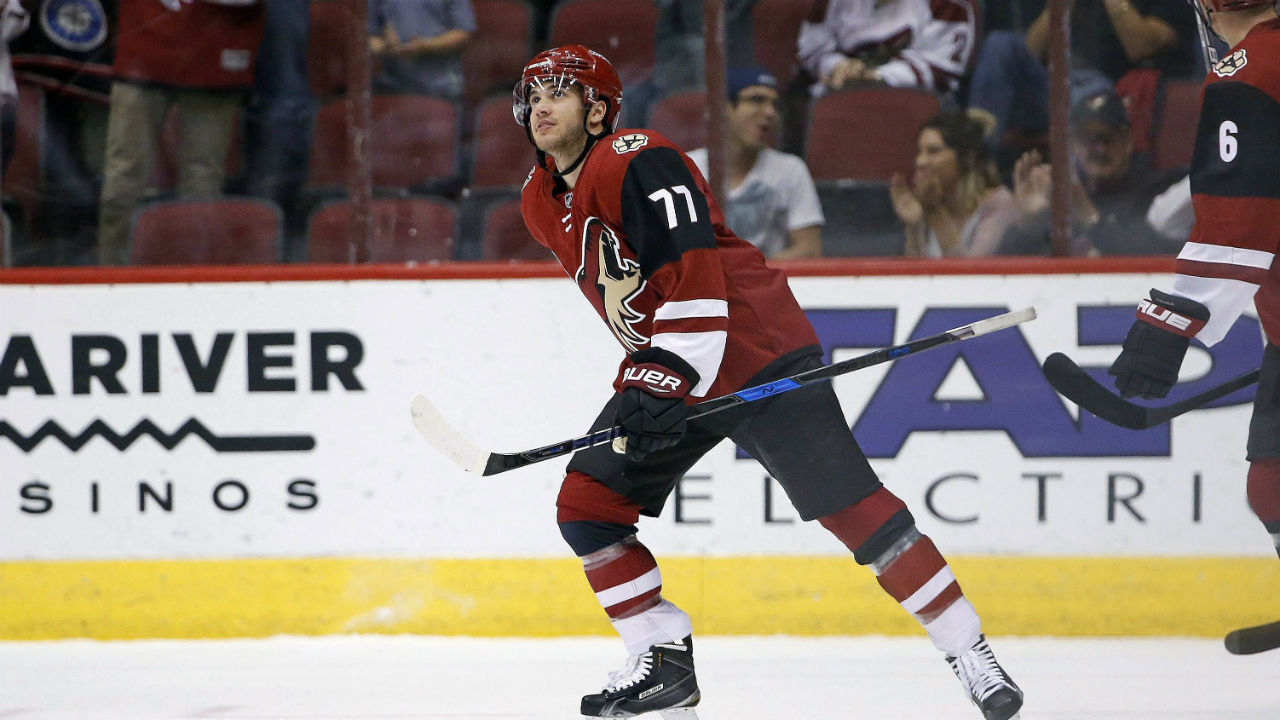 Arizona-Coyotes'-Anthony-DeAngelo-(77)-looks-up-at-the-scoreboard-after-celebrating-his-goal-against-San-Jose-Sharks.-(Ross-D.-Franklin/AP)