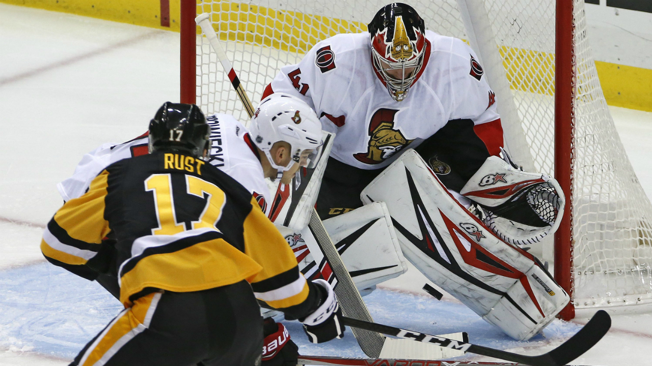 Pittsburgh-Penguins'-Bryan-Rust-(17)-gets-the-puck-between-the-pads-of-Ottawa-Senators-goalie-Craig-Anderson-(41)-for-a-goal-in-the-first-period-of-an-NHL-hockey-game-in-Pittsburgh,-Monday,-Dec.-(Gene-J.-Puskar/AP)