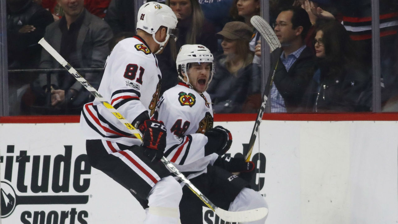 Chicago Blackhawks left wing Vinnie Hinostroza, right, celebrates with right wing Marian Hossa, of Slovakia. (David Zalubowski/AP)