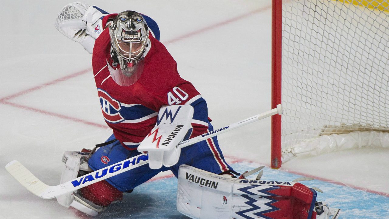 Montreal-Canadiens-goalie-Charlie-Lindgren-makes-a-save-during-third-period-NHL-pre-season-hockey-action-against-the-New-Jersey-Devils-in-Montreal,-Monday,-September-26,-2016.-(Graham-Hughes/CP)
