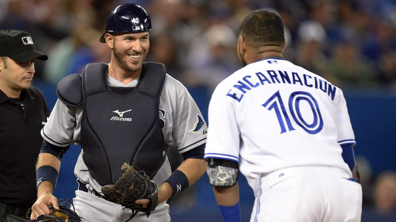 Toronto-Blue-Jays'-Edwin-Encarnacion-and-Tampa-Bay-Rays-catcher-J.P.-Arencibia-share-a-laugh-after-Encarnacion-fouled-out-to-Arencibia-during-fourth-inning-AL-MLB-baseball-action-in-Toronto-on-Friday,-Sept.-25,-2015.-(Frank-Gunn/CP)