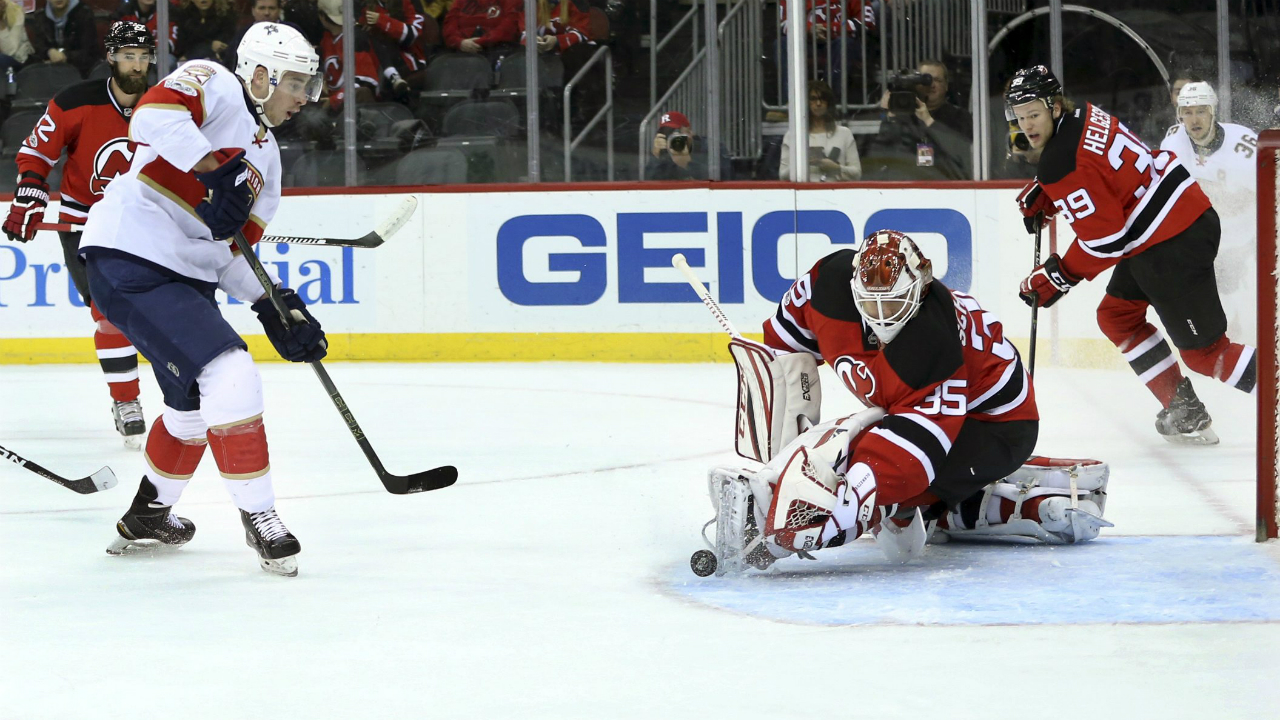 Florida-Panthers-right-wing-Reilly-Smith-(18)-puts-the-puck-into-the-net-for-a-goal-past-New-Jersey-Devils-goalie-Cory-Schneider-(35)-during-the-first-period-of-an-NHL-hockey-game-Monday,-Jan.-9,-2017,-in-Newark,-N.J.-(Mel-Evans/AP)