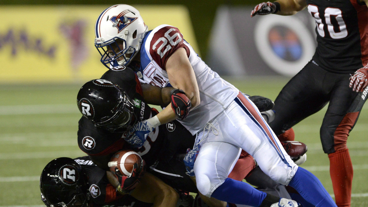 Montreal-Alouettes'-Nicholas-Shortill-(26)-tackles-Tristan-Jackson-(38)-and-Patrick-Lavoie-(81)-during-second-half-CFL-action-on-Friday,-Aug.-19,-2016-in-Ottawa.-(Justin-Tang/CP)