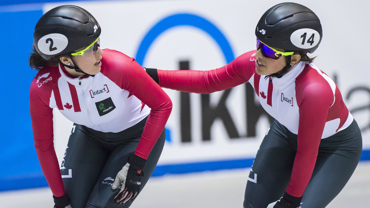 Third-placed-Valerie-Maltais-of-Canada,-right,-congratulates-winner-Marianne-St-Gelais-of-Canada,-left,-during-the-women-1,000-meters-final-race-at-the-short-track-speed-skating-World-Cup-in-Dresden,-eastern-Germany,-Saturday,-Feb.-4,-2017.-(Jens-Meyer/AP)