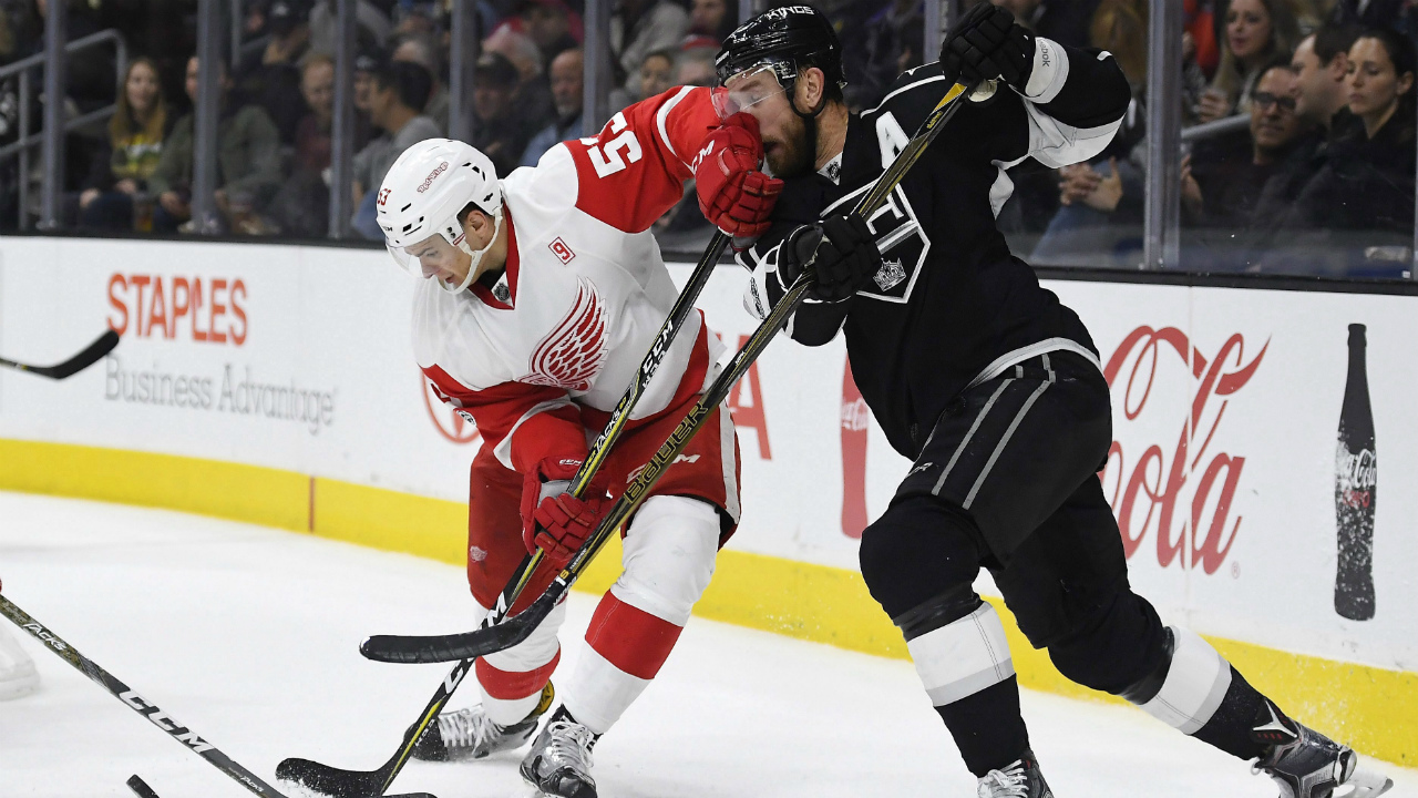 Detroit-Red-Wings-defenceman-Alexey-Marchenko,-left,-of-Russia,-hits-Los-Angeles-Kings-centre-Jeff-Carter-in-the-face-as-he-plays-the-puck-during-the-second-period-of-an-NHL-hockey-game,-Thursday,-Jan.-5,-2017,-in-Los-Angeles.-(Mark-J.-Terrill/AP)