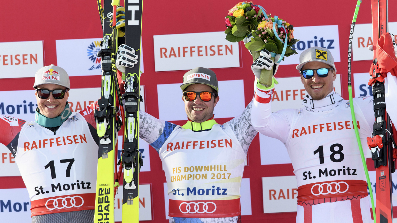 From-left,-Silver-medallist-Erik-Guay-of-Canada,-Gold-medallist-Beat-Feuz-of-Switzerland-and-Bronze-medallist-Max-Franz-of-Austria-celebrate-on-the-podium-during-the-men's-downhill-race-at-the-2017-FIS-Alpine-Skiing-World-Championships-in-St.-Moritz,-Switzerland,-Sunday,-Feb,-12,-2017.-(Peter-Schneider/Keystone-via-AP)