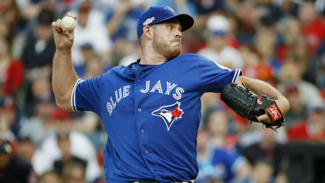 Toronto-Blue-Jays-relief-pitcher-Joe-Biagini-throws-against-the-Cleveland-Indians-during-the-sixth-inning-in-Game-2-of-baseball's-American-League-Championship-Series-in-Cleveland,-Saturday,-Oct.-15,-2016.-Toronto-currently-has-right-hander-Mike-Bolsinger-on-its-40-man-roster-while-Gavin-Floyd-and-Brett-Oberholtzer-are-listed-among-non-roster-invitees-who-will-have-a-chance-to-prove-themselves-this-spring.-Reliever-Biagini,-who-was-a-starter-before-joining-the-Blue-Jays-last-year,-could-also-be-stretched-out.-(Gene-J.-Puskar/AP)